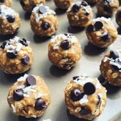 - 1 cup rolled oats - 1/2 cup natural peanut butter - 1/4 cup honey or maple syrup - 1/4 cup ground flaxseed - 1/2 cup dark chocolate chips (or carob chips for a unique twist) - 1/4 cup shredded coconut (unsweetened) - 1/2 teaspoon vanilla extract - A pinch of sea salt Each serving has: - Calories: ~120 - Protein: 3g - Carbs: 15g - Fat: 6g - Fiber: 2g - Sugar: 5g These energy bites pack a punch with good carbs and healthy fats. They keep you full and give you energy for your day. If you have allergies or need other options, here are some swaps: - Use almond butter or sunflower seed butter instead of peanut butter. - For a vegan option, choose maple syrup over honey. - Swap dark chocolate chips for dried fruit for a sweeter bite. - Omit shredded coconut if you dislike it; the bites still taste great! Use these simple substitutes to fit your diet, and enjoy every bite! To make these tasty Peanut Butter Bliss Energy Bites, start by gathering your ingredients. First, take a large mixing bowl. Add 1 cup of rolled oats, 1/4 cup of ground flaxseed, and a pinch of sea salt. Mix them well with a spoon. In another bowl, blend 1/2 cup of natural peanut butter, 1/4 cup of honey or maple syrup, and 1/2 teaspoon of vanilla extract. Stir until it looks creamy. Next, pour the peanut butter mixture into the bowl with the dry ingredients. Mix everything until it’s well combined. Now, fold in 1/2 cup of dark chocolate chips and 1/4 cup of shredded coconut. Make sure the chips and coconut are evenly spread throughout the mix. Using your hands, scoop out a tablespoon of the mixture. Roll it into a ball. Place the balls on a lined baking sheet. Repeat this until all the mixture is gone. Put the baking sheet in the fridge for about 30 minutes. This helps the bites get firm. Once they are set, store them in an airtight container. They can stay fresh in the fridge or at room temperature for up to a week. For a perfect texture, make sure to mix well. Each ingredient should blend nicely. If the mixture feels too dry, add a touch more peanut butter. If it’s too wet, add more oats. You want a sticky yet firm mixture. Rolling the bites in your hands should not be messy. They should hold their shape after chilling. While I can't show you a video, I encourage you to check online for visual guides. Watching someone make these energy bites can provide helpful tips. Look for videos that show each step. You’ll see how the mixture looks at each stage. This can help you feel more confident in making your own Peanut Butter Bliss Energy Bites. To prevent your energy bites from sticking, keep your hands wet. Dampen your palms before rolling the mixture. This simple trick helps the mixture glide smoothly. You can also chill the mixture in the fridge for 10 minutes before rolling. This makes it firmer and easier to handle. A good serving size is about one tablespoon. This size gives you a nice energy boost. You can enjoy 2-3 bites as a snack. They’re perfect before or after workouts. Adjust the serving based on your hunger and activity level. These energy bites pair well with fresh fruit. Try them with apple slices or banana halves. You can also enjoy them with yogurt for a quick breakfast. For a fun twist, dip them in dark chocolate. This adds a rich flavor and makes a great treat. {{image_2}} You can change the flavor of your energy bites easily. Try adding cocoa powder for a chocolate kick. Just mix in two tablespoons of unsweetened cocoa. You can also use protein powder. This adds protein and makes them more filling. Choose your favorite flavor of protein powder. It can be vanilla, chocolate, or even strawberry! To boost nutrition, add nuts or seeds. Chopped almonds or walnuts add crunch and healthy fats. Sunflower seeds and chia seeds are also great choices. They add fiber and omega-3s. You can mix in a quarter cup of your favorite nuts or seeds. This extra touch makes them even more tasty and healthy. Get creative with seasonal flavors. In the fall, try pumpkin spice. Add a quarter cup of pumpkin puree and a teaspoon of pumpkin spice. This gives a warm flavor perfect for autumn. In the summer, use fresh berries. Mash them up and mix them in for a fruity twist. You can have fun changing the flavors with each season! For the complete list of ingredients and instructions, check out the Full Recipe. To keep your peanut butter energy bites fresh, store them in an airtight container. This helps prevent them from drying out. You can keep the bites in the fridge or at room temperature. If you live in a warm area, the fridge is best. It helps maintain their shape and flavor. These energy bites can last up to one week. In the fridge, they stay fresh longer. At room temperature, they may lose their texture after a few days. Always check for any change in smell or look before eating. You can freeze energy bites for longer storage. Place them in a single layer on a baking sheet. Once they are firm, transfer them to an airtight container or freezer bag. They can last up to three months in the freezer. When ready to eat, let them thaw in the fridge or at room temperature. You can use any nut butter you like. Almond butter, cashew butter, or sun butter work well. Each choice adds its own flavor. Just ensure it's a smooth, creamy type. Check for any added sugars or oils if you want a healthier option. Yes, you can easily make them vegan! Replace honey with maple syrup. This keeps the bites sweet and plant-based. All other ingredients are vegan-friendly too. Enjoy a tasty snack that fits your diet. After chilling in the fridge for about 30 minutes, check their firmness. They should hold their shape when you press them. If they are too soft, chill for another 10 minutes. This helps them become nice and firm. For the complete recipe and detailed steps, visit the Peanut Butter Bliss Energy Bites 🥜 section. This blog post covered the key ingredients and how to prepare tasty energy bites. We explored helpful tips to get the right texture and avoid sticking. You learned about fun flavor variations and nutritious add-ins to personalize your bites. Lastly, we discussed smart ways to store them and answered common questions. I hope you feel ready to try making energy bites yourself. Enjoy the process and the tasty results!