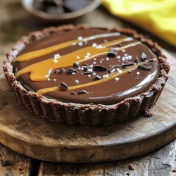 - 1 ½ cups all-purpose flour - ½ cup unsweetened cocoa powder - ½ cup powdered sugar - ½ cup unsalted butter, softened - 1 large egg yolk - 1-2 tablespoons cold water - 1 cup granulated sugar - 6 tablespoons unsalted butter, cubed - ½ cup heavy cream - 1 teaspoon sea salt - 8 ounces dark chocolate (70% cocoa), chopped - 1 cup heavy cream - 1 teaspoon vanilla extract - Flaky sea salt for sprinkling - Dark chocolate shavings (optional) Let’s dive into what makes this tart so special. For the crust, you need flour, cocoa powder, and powdered sugar to build a rich base. The butter adds creaminess, and the egg yolk helps bind it all together. You might need cold water to shape the dough just right. Next, we have the salted caramel. This part is all about melting sugar to golden perfection. You will mix in the butter and cream to create a smooth texture. Don't forget the sea salt! It balances the sweetness beautifully. For the chocolate ganache, dark chocolate is key. It brings depth and richness. The heavy cream will melt the chocolate into a silky smooth sauce. A splash of vanilla extract adds an extra layer of flavor. Finally, you can garnish with flaky sea salt and dark chocolate shavings. They give a nice touch and enhance the tart's look! Each ingredient plays a role in making this dessert delightful. 1. Mixing dry ingredients and butter: In a large bowl, whisk together 1 ½ cups of all-purpose flour, ½ cup of unsweetened cocoa powder, and ½ cup of powdered sugar. Add ½ cup of softened unsalted butter. Mix until you see small crumbs. 2. Forming the dough and adding cold water: Add 1 large egg yolk to the crumb mixture. Mix well. Then, add 1-2 tablespoons of cold water, one tablespoon at a time, until the dough holds together. 3. Prepping the tart pan and baking: Preheat your oven to 350°F (175°C). Press the dough into a 9-inch tart pan evenly across the bottom and up the sides. Prick the bottom with a fork. Bake for 15-20 minutes until firm. Let it cool completely. 1. Melting sugar and adding butter: In a medium saucepan, heat 1 cup of granulated sugar over medium heat. Stir continuously until the sugar melts and turns golden amber. 2. Incorporating heavy cream and salt: Once melted, add 6 tablespoons of cubed unsalted butter. Stir until melted. Slowly pour in ½ cup of heavy cream while stirring. The mixture will bubble, so be careful! After one minute, remove from heat and stir in 1 teaspoon of sea salt. 1. Heating cream and melting chocolate: Place 8 ounces of chopped dark chocolate in a heatproof bowl. In a small saucepan, heat 1 cup of heavy cream until just below boiling. 2. Combining chocolate and cream smoothness: Pour the hot cream over the chocolate. Let it sit for 5 minutes. Then whisk until smooth. Stir in 1 teaspoon of vanilla extract. 1. Pouring caramel into crust: Pour the salted caramel into the cooled crust. Spread it out evenly. Let it sit at room temperature for about 30 minutes to set. 2. Adding ganache and chilling time: Pour the chocolate ganache over the caramel layer. Spread it carefully. Refrigerate the tart for at least 2 hours to let it set properly. To avoid toughness in your crust, don’t overwork the dough. Mix the dry ingredients gently with the butter until crumbly. Then, add the egg yolk and cold water. Only add enough water to make the dough hold together. For even baking, preheat your oven to 350°F (175°C). Press the dough into the tart pan evenly. Prick the bottom with a fork to let steam escape. Bake for 15-20 minutes until firm. Let it cool completely before adding the caramel. Crystallization can ruin your caramel. To avoid this, use a clean pan and stir only until the sugar melts. Once it turns golden, add the cubed butter. Stir until melted, then slowly pour in the hot cream while stirring. This will create a smooth caramel. When adding the cream, be careful. The mixture will bubble up. Let it simmer for one minute before you take it off the heat. Stir in the sea salt at the end for the best flavor. To achieve the right ganache texture, use quality dark chocolate. Chop it finely for even melting. Heat the cream just below boiling and pour it over the chocolate. Let it sit for five minutes before whisking. This helps create a smooth and glossy finish. If you want to adjust sweetness or bitterness, add a bit more cream for a milder taste. If you prefer a richer flavor, use less cream. Remember, the ganache will firm up when chilled, so keep that in mind when making your tart! {{image_2}} You can spice up your tart with a few simple changes. Adding espresso to the ganache gives a rich flavor boost. Just mix one tablespoon of espresso powder into the ganache. You can also sprinkle a little sea salt on top for extra zing. Different types of chocolate can change the taste too. Dark chocolate provides a deep flavor, while milk chocolate adds sweetness. You might even try white chocolate for a creamy twist! If you need a gluten-free option, swap the all-purpose flour for a gluten-free blend. This keeps the crust tasty without gluten. You can also experiment with different crust flavors. Using ground nuts, like almonds or hazelnuts, creates a nutty taste. Crushed biscuits, like graham crackers, can also work well. They add a sweet crunch that pairs nicely with the filling. Want a vegan version? Replace the butter with coconut oil and use plant-based cream. You can also find vegan chocolate for the ganache. For sugar substitutes, try using maple syrup or agave nectar in the caramel. Keep in mind, these swaps may change the tart's texture slightly. Adjust as needed to find your perfect balance! To keep your chocolate salted caramel tart fresh, store it in the refrigerator. Place it in an airtight container. This will help maintain its flavor and texture. If you don’t have a container, cover the tart with plastic wrap. This will prevent it from drying out and protect it from strong odors in the fridge. You can freeze both unbaked and baked tarts. If you freeze the unbaked tart, wrap it tightly in plastic wrap. This way, you can bake it later for a fresh treat. For baked tarts, let them cool completely before freezing. Once cool, wrap them well. When you are ready to eat, thaw the tart in the fridge overnight. This keeps it from getting too soggy. Enjoy your delicious tart any time! To make your caramel less thick, try these tips: - Use more heavy cream when making caramel. - Cook the sugar for less time before adding cream. - Stir the mixture continuously while cooking. These steps will help create a smoother, runnier caramel. The extra cream adds moisture, making the caramel more fluid. Yes, you can use milk chocolate for the ganache. - Milk chocolate is sweeter and creamier than dark chocolate. - It gives a softer flavor and texture in the tart. However, if you want a more intense taste, stick with dark chocolate. Dark chocolate balances well with the salted caramel, creating a rich experience. The tart lasts about 3 to 4 days in the refrigerator. - Store it in an airtight container to keep it fresh. - The flavors will deepen over time, making it even more delicious! Just make sure to check for any signs of spoilage before serving. Absolutely! You can make this tart a day or two in advance. - Bake the crust and prepare the caramel, then assemble it. - Store it in the fridge after adding the ganache. This way, you save time on the day of serving. Just remember to let it sit at room temperature for a bit before serving. In this blog post, we covered how to make a delicious tart from scratch. We discussed crust ingredients, salted caramel, and chocolate ganache. You learned step-by-step instructions and helpful tips to perfect your tart. Try flavor variations for fun twists. Store it properly to keep it fresh. Finally, don't hesitate to prep ahead for easy servings later. Enjoy your baking journey and impress your guests with this tasty treat!