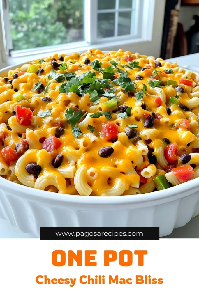 Savor the flavors of our Cheesy Chili Mac Skillet One Pot recipe! This quick and easy dish combines elbow macaroni, black beans, and zesty tomatoes, all topped with melted cheddar cheese for a creamy finish. Perfect for busy weeknights, it’s a meal the whole family will love. Discover the full recipe and make dinner effortless and delicious tonight! Click through for step-by-step instructions! #OnePotRecipes #CheesyChiliMac #DinnerIdeas #ComfortFood
