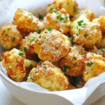 - 1 medium cauliflower head, cut into florets - 3 tablespoons olive oil - 4 cloves garlic, minced - 1/2 cup grated Parmesan cheese - 1 teaspoon paprika - 1 teaspoon onion powder - Salt and pepper to taste - Chopped parsley for garnish (optional) - For the cauliflower, you want a medium size. This gives enough for four servings. - Use three tablespoons of olive oil to coat the florets well. This helps them crisp up. - Mince four cloves of garlic for a strong flavor. Garlic makes this dish pop! - Grate half a cup of Parmesan cheese. This adds a rich, savory taste. - One teaspoon each of paprika and onion powder boosts the flavor profile. - Add salt and pepper to your taste. Seasoning is key for great taste. - If you like, chop some parsley for garnish. It adds color and freshness. - You can swap olive oil for avocado oil if you prefer. - If you don’t have garlic, try using garlic powder. Use about one teaspoon. - Instead of Parmesan, try using nutritional yeast for a vegan option. - For a different flavor, use cheddar cheese instead of Parmesan. - If you want more spice, add cayenne pepper instead of paprika. Just a pinch will do! - Fresh herbs like thyme or rosemary can replace parsley for garnish. Feel free to mix and match these ingredients based on what you have. Cooking should be fun and flexible! Start by rinsing the cauliflower well. Cut the head into small florets. This helps them cook evenly. Make sure the florets are not too big. Smaller pieces get crispy faster. In a large bowl, add the cauliflower florets. Pour in 3 tablespoons of olive oil. Then, add 4 minced garlic cloves. Sprinkle in 1 teaspoon of paprika and onion powder each. Season with salt and pepper. Toss everything together well. Ensure each floret is coated with oil and spices. Finally, add 1/2 cup of grated Parmesan cheese. Toss again until all pieces are well covered. Preheat your air fryer to 375°F (190°C) for about 5 minutes. Place the cauliflower in the basket in a single layer. Do not crowd the basket; this helps them cook better. Air fry for 15-18 minutes. Shake the basket halfway through cooking. This ensures even crispiness. When they are golden brown, remove them from the fryer. Let them cool for a couple of minutes. You can add chopped parsley on top for extra color. Enjoy your delicious Garlic Parmesan Cauliflower! To get that perfect crunch, use fresh cauliflower. Cut it into small florets. This helps them cook evenly. Make sure to coat them well in olive oil. This oil helps the cauliflower get crispy. Air fry them in a single layer. Overcrowding can lead to soggy bites. Shake the basket halfway through cooking. This ensures all sides cook well. Use fresh garlic for the best taste. Mince it finely to release its flavor. Mix it well with the cheese and spices. Adding paprika gives a nice touch of warmth. Don't skip the salt and pepper. They enhance all the other flavors. You can experiment with spices too. Try adding a pinch of cayenne for heat. Serving is just as important as cooking. Use a bright bowl to show off your dish. Line it with parchment paper for a clean look. Sprinkle extra Parmesan on top for a cheesy finish. Add chopped parsley for a pop of color. This makes your dish look fresh and inviting. Don't forget to serve it warm for the best experience! {{image_2}} You can change the cheese for this recipe. Try using cheddar or gouda. Both add nice flavor. If you want a softer taste, use mozzarella. For a stronger kick, try blue cheese. These options will give a fresh twist to your dish. Feel free to mix in new spices. Add some cayenne pepper for heat. This will spice things up a bit. You can also try Italian herbs like oregano or basil. For a smoky taste, add smoked paprika. Experimenting with seasonings makes it fun to cook. You can easily make this dish vegan. Swap the Parmesan cheese for a vegan cheese. Nutritional yeast also gives a cheesy flavor without dairy. For gluten-free options, ensure all spices are gluten-free. This dish is flexible, so you can enjoy it no matter your diet. To keep your Garlic Parmesan cauliflower fresh, place it in an airtight container. Make sure the container is clean and dry. Store it in the fridge for up to three days. If you want to keep it longer, consider freezing it. For the best taste, reheat your leftovers in the air fryer. Set the air fryer to 350°F (175°C). Heat for about 5-7 minutes until the cauliflower is warm and crispy again. You can also use a microwave, but it may make the cauliflower soft. You can freeze Garlic Parmesan cauliflower for later. Place it in a freezer-safe bag or container. Remove as much air as possible to avoid freezer burn. It will stay good for about one month. When you're ready to eat it, thaw it in the fridge overnight before reheating. Yes, you can use frozen cauliflower. Just make sure to thaw it first. Drain any excess water. This helps the cauliflower crisp up in the air fryer. Adjust the cooking time if needed. Start with 10-15 minutes, and check for doneness. The cauliflower is done when it turns golden brown and feels crispy. You can test it by sticking a fork in a floret. If it feels tender and the outside is crispy, it is ready. I recommend shaking the basket halfway through the cooking time for even crispiness. This dish pairs well with many items. Here are some ideas: - Grilled chicken or fish for protein - A fresh salad for crunch - Quinoa or rice for a hearty side - Pasta with olive oil for a complete meal Feel free to mix and match based on your taste! This blog post covered everything you need for Garlic Parmesan Cauliflower. We looked at the key ingredients and how to measure them. I shared the best substitutes, step-by-step cooking instructions, and tips for perfecting your dish. Don't forget the variations for cheese and spices, and how to store leftovers. Cooking can be fun and easy. With this guide, you'll impress everyone at your next meal. Enjoy your cooking adventures!