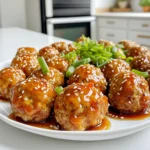 - 1 pound ground chicken or turkey - 1/2 cup breadcrumbs - 1/4 cup grated Parmesan cheese - 2 cloves garlic, minced - 1 egg - 1 teaspoon dried oregano - 1/2 teaspoon salt - 1/4 teaspoon black pepper - 1/4 cup honey - 2-3 tablespoons Sriracha (adjust to taste) - 1 tablespoon soy sauce - 1 teaspoon sesame oil - Garnishes: sesame seeds and chopped green onions To create my Sriracha Honey Glazed Meatballs, I start with the meatball base. I use one pound of ground chicken or turkey. This choice keeps the meatballs lean without losing flavor. Next, I add half a cup of breadcrumbs. This helps bind the mixture and gives it a nice texture. I also include a quarter cup of grated Parmesan cheese for a rich, salty kick. For flavoring, I use two cloves of minced garlic. Garlic adds depth and aroma to the meatballs. Then, I crack in one egg to help hold everything together. I add a teaspoon of dried oregano for a hint of herbiness. Finally, I sprinkle in half a teaspoon of salt and a quarter teaspoon of black pepper. These spices enhance the overall taste. Now for the glaze. I mix a quarter cup of honey with two to three tablespoons of Sriracha. I adjust the Sriracha based on how spicy I want it. I also add a tablespoon of soy sauce for saltiness and a teaspoon of sesame oil for richness. When serving, I love to garnish with sesame seeds and chopped green onions. They add a fresh crunch and a pop of color to the meatballs. This combination of ingredients makes for a delightful dish that is both sweet and spicy! First, you need to preheat your oven to 400°F (200°C). This step is key for getting crispy meatballs. While the oven warms, grab a large bowl. Combine the ground chicken or turkey, breadcrumbs, Parmesan cheese, minced garlic, egg, dried oregano, salt, and black pepper. Make sure to mix everything well. You want a smooth blend for great flavor in each bite. Now, shape the mixture into small meatballs. Aim for about 1 inch in diameter. Place them on a baking sheet lined with parchment paper. This keeps them from sticking and makes clean-up easy. Bake the meatballs in your preheated oven for around 20 minutes. Look for a nice golden color, which means they are cooked through. While the meatballs bake, let’s make the glaze. In a separate bowl, whisk together honey, Sriracha, soy sauce, and sesame oil. If you like it spicy, add more Sriracha. After 20 minutes, take the meatballs out of the oven. Brush half of the glaze over them. This adds a sweet and spicy kick. Return them to the oven for another 5 minutes. This step caramelizes the glaze and makes it sticky and delicious. Once done, let the meatballs rest for a few minutes. Garnish with sesame seeds and chopped green onions for extra flavor and crunch. Enjoy your tasty creation! To get the best meatballs, mix the meat and ingredients well. Make sure to combine everything without overworking the mixture. Overworking can make meatballs tough. For juicy meatballs, adjust the cooking time. Bake them until they are just cooked through. Usually, 20 minutes works well. If you want them extra juicy, you can take them out a bit sooner. You can change the Sriracha amount to suit your taste. Start with the lower end, around 2 tablespoons. If you like more heat, add another half tablespoon at a time. Remember, the glaze will intensify as it cooks. For a milder option, try using less Sriracha or a mix of honey and soy sauce. You can also use sweet chili sauce instead for a gentler spice. To make these meatballs even better, try adding herbs or spices. Fresh basil, cilantro, or parsley can add great flavor. You can also experiment with a pinch of cumin or smoked paprika for added depth. Incorporating other ingredients can change things up too. Add finely chopped bell peppers or scallions to the meat mixture. These ingredients bring in extra moisture and flavor, making your meatballs even more delicious! {{image_2}} You can try different meats for these meatballs. Ground beef works well if you want a richer flavor. Ground pork is also a great choice, adding a bit of sweetness. For those who prefer plant-based options, use lentils or chickpeas. These alternatives can give you the same satisfying texture and flavor. If you need a gluten-free option, simply use gluten-free breadcrumbs. They work just as well in holding the meatballs together. Make sure to check your sauces too. Some soy sauces contain gluten, so opt for a gluten-free version. To change up the flavor, consider adding different sauces. Sweet chili sauce or teriyaki sauce can add a unique twist. You can also use flavored oils, like garlic or chili oil, to enhance the taste. Experimenting with marinades can take your meatballs to a whole new level. Store your Sriracha honey glazed meatballs in an airtight container. Place them in the fridge for up to four days. Make sure they cool completely before sealing. This keeps them fresh and tasty. For longer storage, freeze the meatballs. Place them in a single layer on a baking sheet. After they freeze solid, transfer them to a freezer bag. This method helps keep their shape. They can last for up to three months in the freezer. You can reheat your meatballs easily. Use the oven for the best results. Preheat it to 350°F (175°C) and place the meatballs on a baking sheet. Heat them for about 10-15 minutes. This keeps them juicy and flavorful. If you're in a hurry, you can use the microwave. Place the meatballs in a microwave-safe dish. Add a splash of water to keep them moist. Heat in short bursts of 30 seconds. Check them often to avoid overcooking. Making these meatballs in bulk is a smart move. You can double the recipe and store extras. This makes quick meals easy. Use them in sandwiches, salads, or as a snack. Incorporate them into your meal planning. Pair them with rice, noodles, or vegetables. You can even add them to a stir-fry. This way, you have tasty options ready throughout the week. You can serve these meatballs with many tasty sides. Here are some ideas: - Steamed rice or jasmine rice - Noodles, like udon or soba - Fresh salad with crunchy veggies - Stir-fried broccoli or green beans - Crispy spring rolls or egg rolls Pairing these sides enhances the meal. Each brings out the sweet and spicy notes of the meatballs. Yes, you can prepare the glaze ahead of time. Here’s how: 1. Mix honey, Sriracha, soy sauce, and sesame oil. 2. Store it in an airtight container in the fridge. This glaze will stay fresh for up to a week. Just give it a quick stir before using. Cooked Sriracha honey glazed meatballs can last in the fridge for about 3 to 4 days. To keep them safe: - Store in an airtight container. - Keep them at a steady, cool temperature. If you want to enjoy them later, freezing is a good option. They can last up to three months in the freezer. Just thaw and reheat when ready to eat. In this article, we explored the tasty world of Sriracha honey glazed meatballs. We covered the key ingredients, from the meatball base to the flavorful glaze. Step-by-step instructions made the cooking easy. I shared tips for perfect texture and spice levels. We also discussed fun variations and smart storage info. Now, you can enjoy these meatballs any time. Get creative with ingredients and share your favorites!